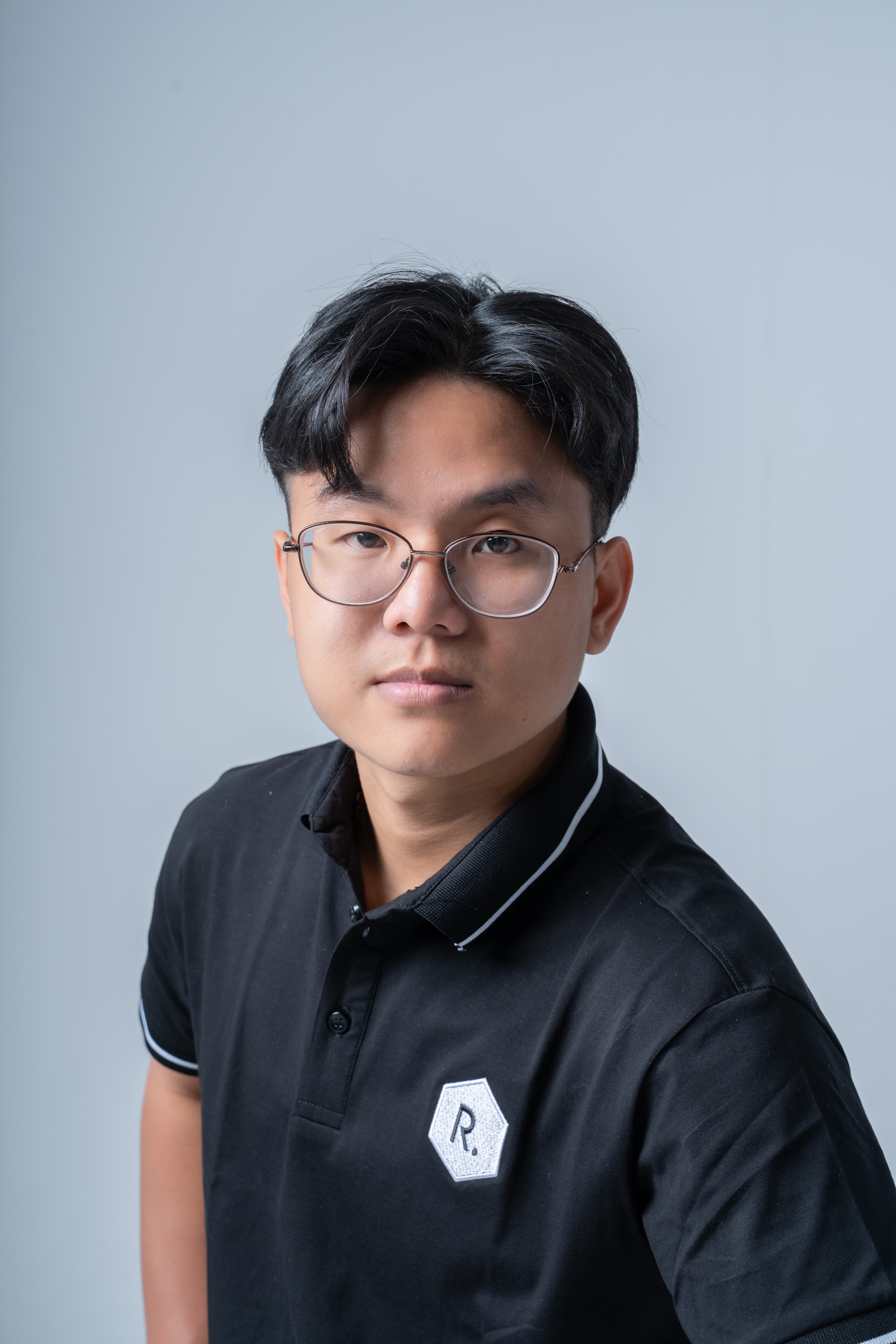 Professional headshot of a senior software developer with friendly expression